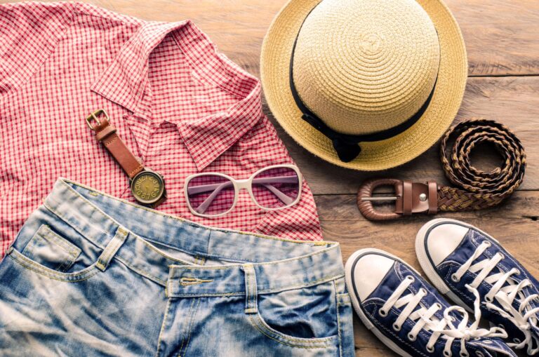 Summer camping clothing including a T-shirt, hat, shorts, and light jacket